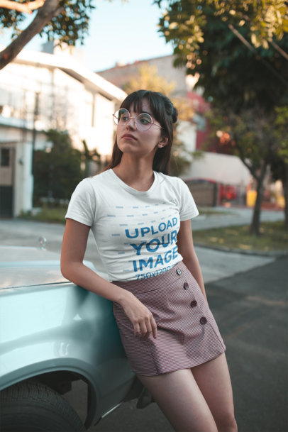 Mockup of a Woman with Round Glasses Wearing a Tshirt on the Street