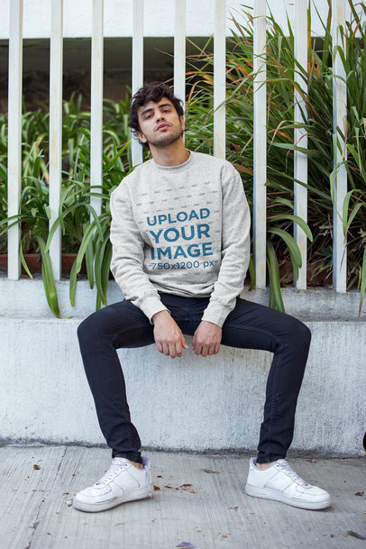 Mockup of a Man Wearing a Heathered Sweater by a Fence 18193