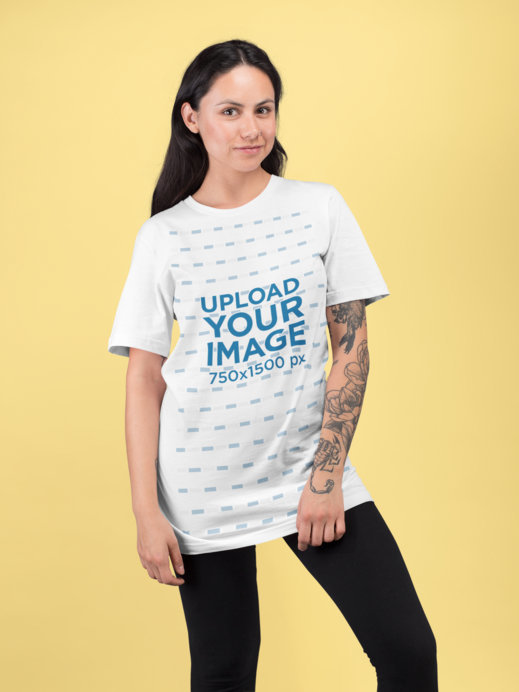 Mockup of a Woman with a Sleeve Tattoo at a Studio Wearing a Loose tee