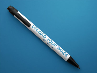 Mockup Featuring a Pen Over a Smooth Background 