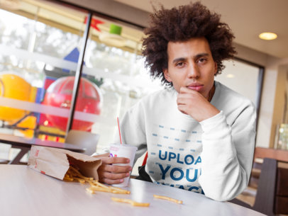 Sweatshirt Mockup of a Man with an Afro Eating Some Fries