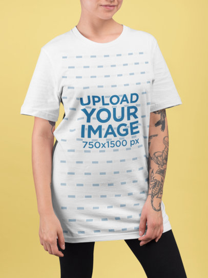 Mockup of a Woman Wearing a Unisex Tee in a Studio