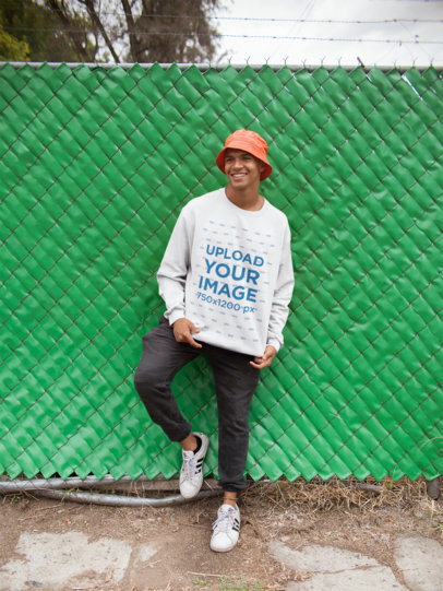 Mockup of a Happy Man Wearing a Sweater in a Urban Environment