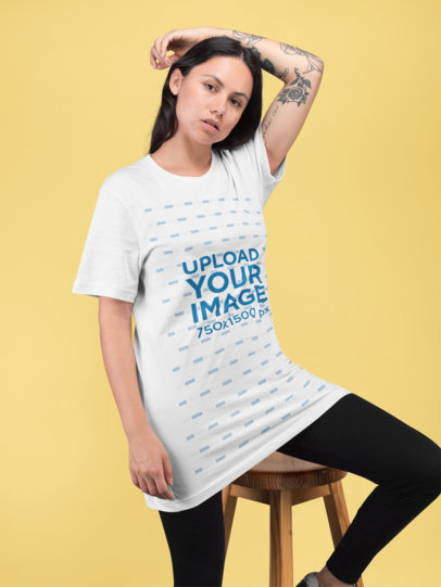 Unisex Tee Mockup of a Woman Posing in a Studio