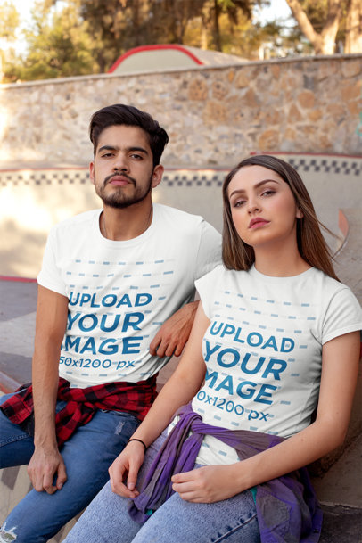 Mockup of a Couple Wearing Tees at a Skate Park