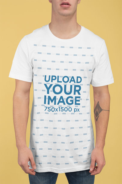 T-Shirt Mockup of a Man with a Tattoo at a Studio