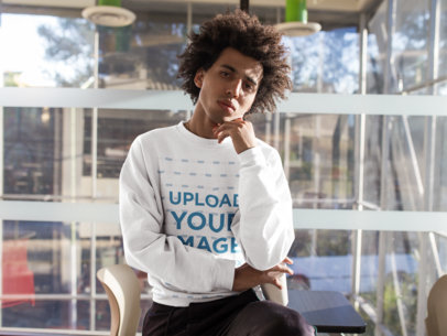 Crewneck Sweatshirt Mockup of a Pensive Man with Curly Hair