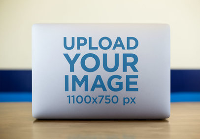 Mockup of a Laptop Sticker on a Desk