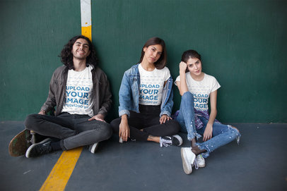 Tshirt Mockup of a Group of Three Friends at a Fronton Court