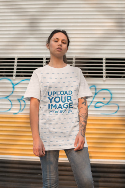 Unisex Tee Mockup of a Serious Woman Looking down at the Camera