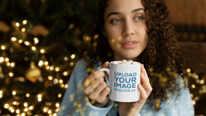 Mug Parallax Video Mockup of a Woman Enjoying Cocoa Next to the Christmas Tree