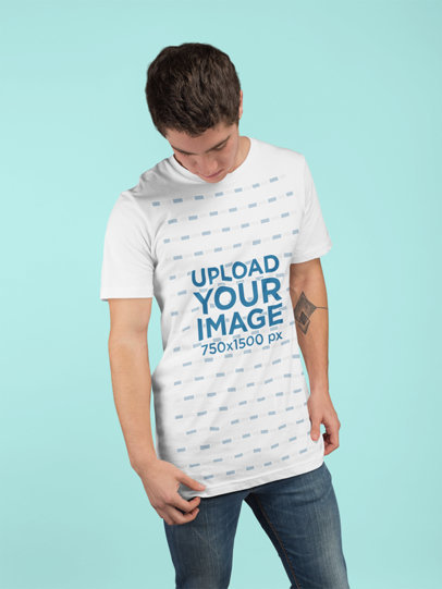 Tshirt Mockup of a Man with a Tattoo at a Studio