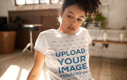 Tee Mockup Featuring a Woman with a Kinky Curly Ponytail