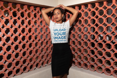 T-Shirt Mockup of a Braided Woman in a Red Pattern Wall Corner