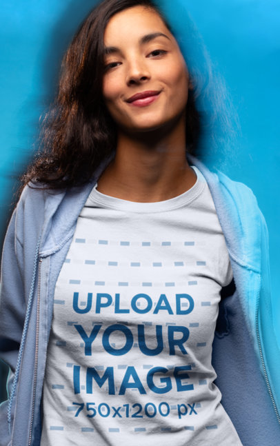 Mockup of a Woman Wearing a T-Shirt in a Studio