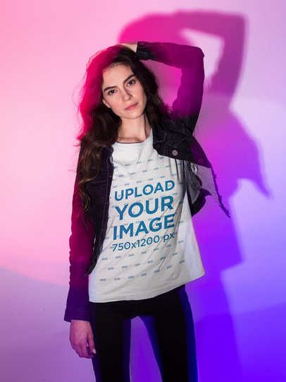 Tee Mockup of a Woman Wearing a Fashionable Outfit in a Studio