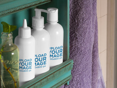 Label Mockup Featuring a Set of Cosmetic Bottles on a Bathroom Shelf 