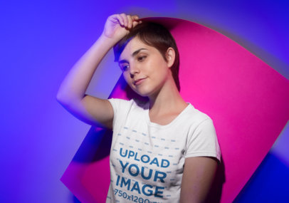 Round Neck Tee Mockup of a Woman Holding a Pasteboard Against Her Head