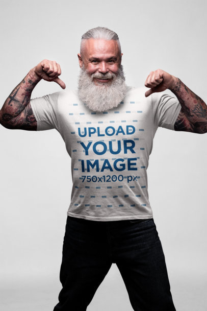 Mockup of an Edgy Bearded Senior Showing off His T-Shirt 