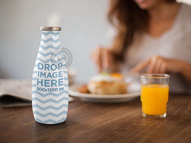 Label Mockup Featuring a Milk Bottle on Top of a Breakfast Table