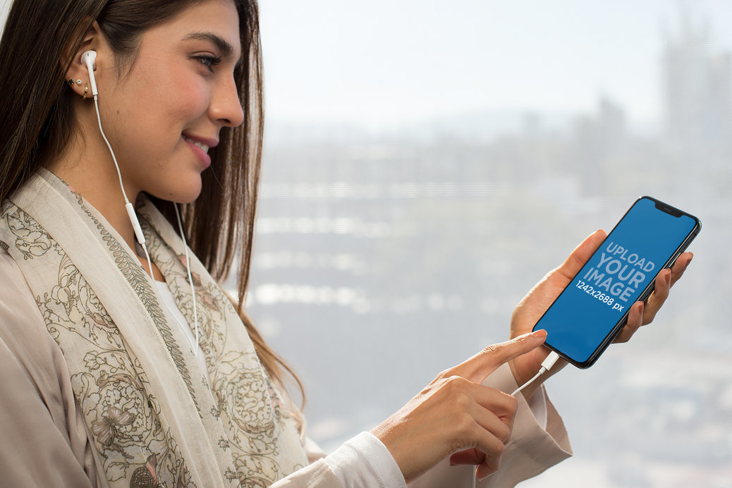 iPhone 11 Pro Max Mockup Featuring a Woman Listening to a Podcast 