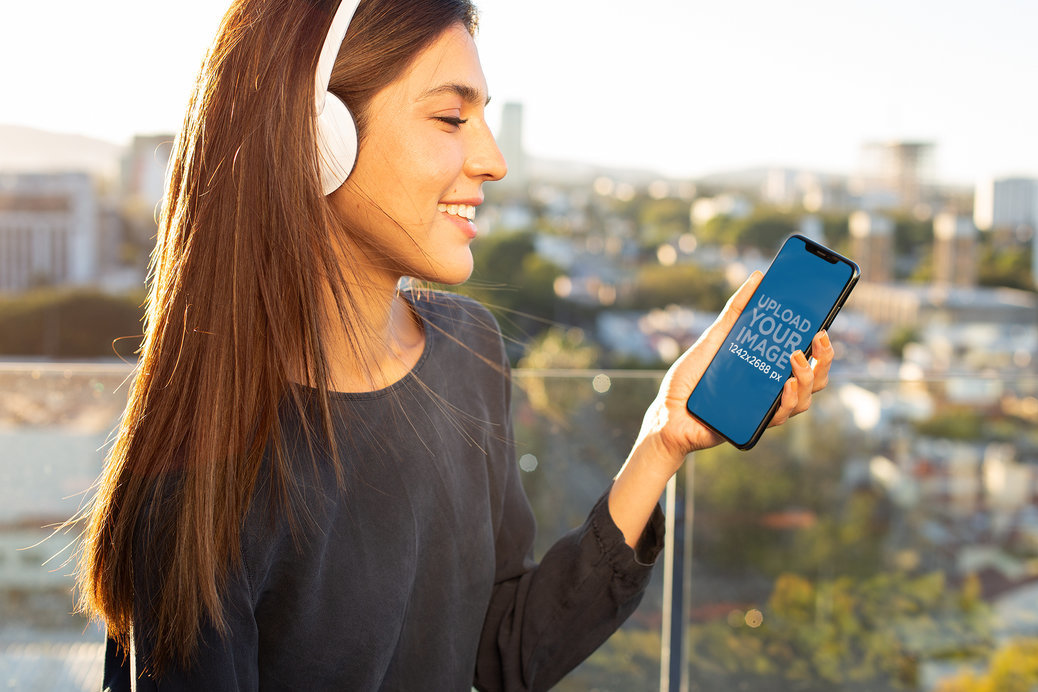iPhone 11 Pro Mockup Featuring a Woman Listening to Music