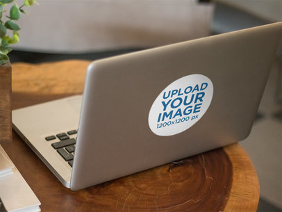 Branding Mockup Featuring a Decal Laptop Sticker on a Macbook Pro