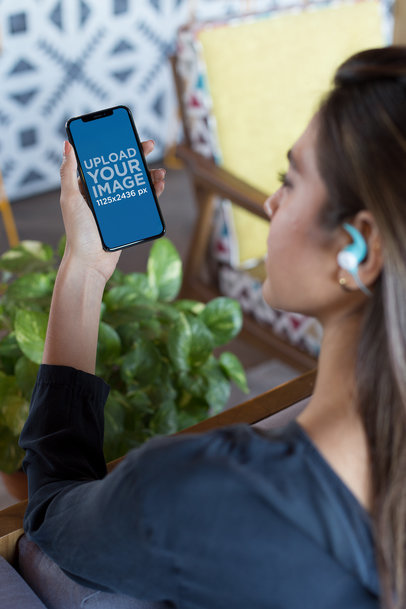 Mockup of an iPhone X Featuring a Woman Listening to a Podcast 24796