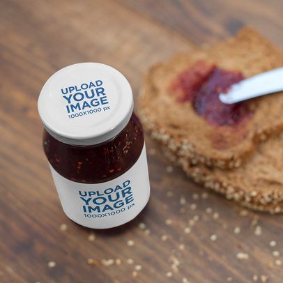Label Mockup of a Jam Jar on a Kitchen Counter Next to Some Bread Slices