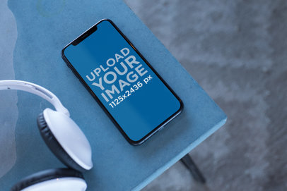 Podcast Mockup Featuring an iPhone X on a Table 24795