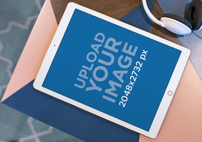 Mockup of an iPad Lying on the Corner of a Multicolor Table