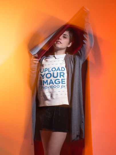 Sweatshirt Mockup Featuring a Woman in a Studio with a Cool Effect