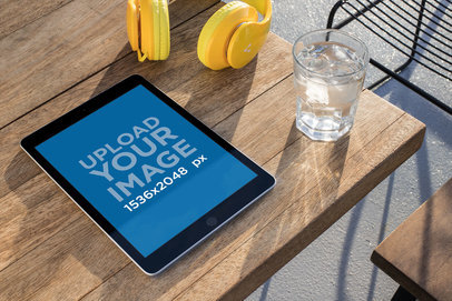 Mockup of an iPad Lying on a Wooden Table