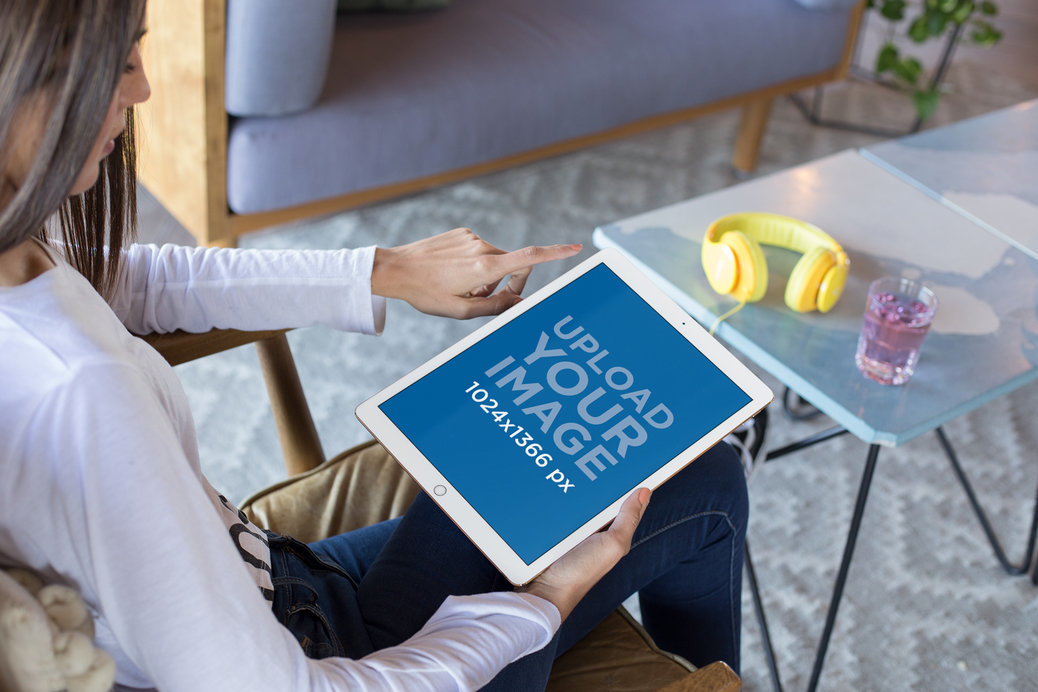 iPad Pro Mockup of a Woman Sitting in a Living Room