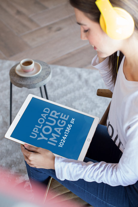 Mockup of a Woman Listening to a Podcast on an iPad Pro