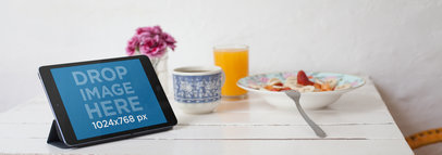 Mockup of an iPad Sitting on Top of a Table in Landscape Position