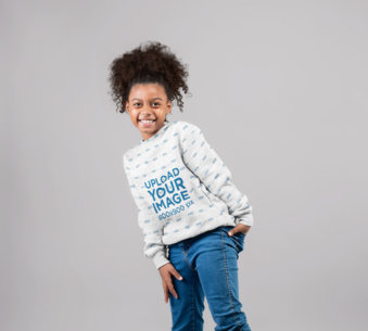 Mockup of a Happy Girl Wearing a Sublimated Sweater in a Photo Studio