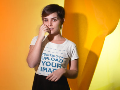 T-Shirt Mockup of a Flirty Woman in a Studio