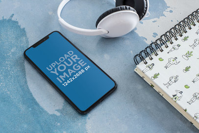 Iphone X Mockup for Podcasts Featuring a Pair of White Headphones 24717