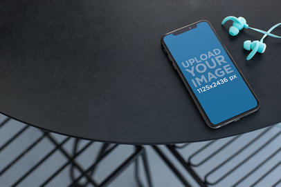 Mockup for a Podcast Featuring an iPhone XS Max Next to a Pair of Blue Earphones 24721 