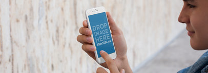 iPhone Mockup Featuring a Guy Holding an iPhone 6