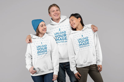 Studio Mockup Featuring Three People Wearing Hoodies