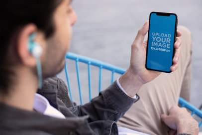iPhone Mockup of a Man Listening to a Podcast with His iPhone XS Max 24814