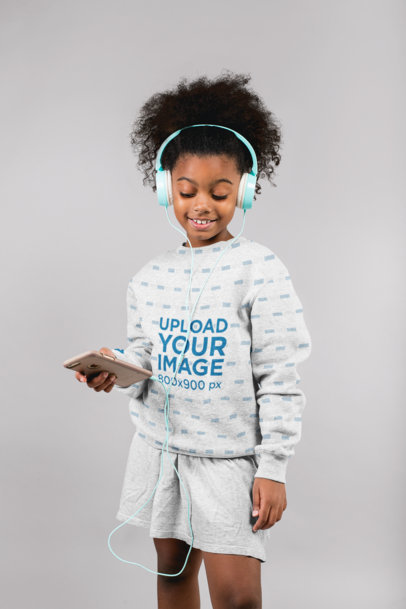 Sweatshirt Mockup of a Happy Girl Listening to Music