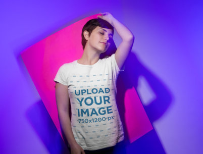 Tshirt Mockup of a Woman Holding a Pasteboard Against her Back