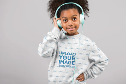 Sublimated Sweatshirt Mockup of a Little Girl with Headphones at a Studio