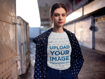 Tee Mockup of a Woman at a Closed Market Place 