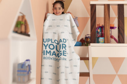 Blanket Mockup Featuring a Playful Girl in Her Room 24691