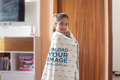 Mockup of a Little Girl Wrapped in a Throw Blanket 24693