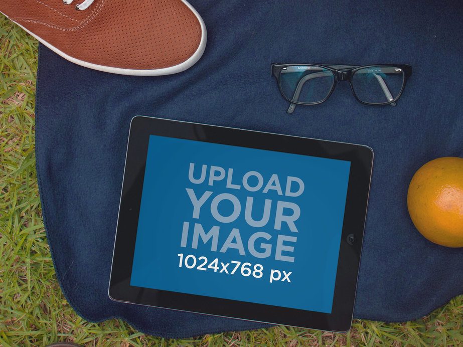 iPad Mockup Featuring Some Objects in a Picnic Setting